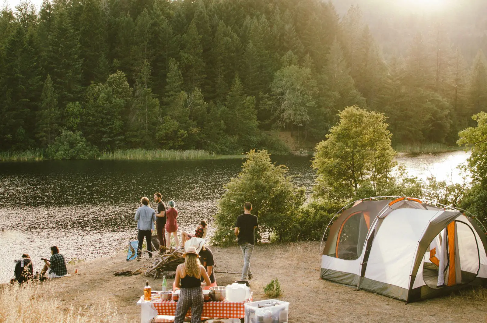 A family camping near a river